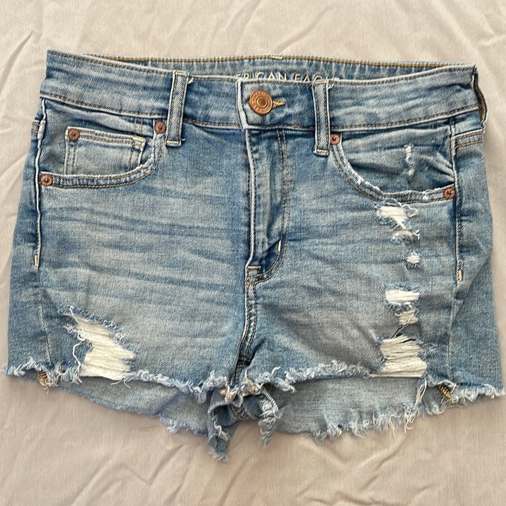 American Eagle Outfitters high rise distressed jean shorts, size 4.